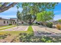 Enjoyable community shuffleboard courts under shady trees at 4937 N Granite Reef Rd, Scottsdale, AZ 85251