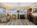 Relaxing sunroom with comfortable seating and a view at 10401 W Desert Forest Cir, Sun City, AZ 85351