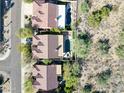 Aerial view of two homes with private pools and desert landscaping at 16593 N 104Th St, Scottsdale, AZ 85255