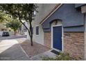 Townhome entrance with blue door and stone accents at 280 S Evergreen Rd # 1270, Tempe, AZ 85288