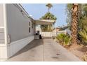 Side view of manufactured home with covered patio at 625 W Mckellips Rd # 213, Mesa, AZ 85201