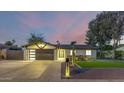 Updated mid-century modern home with a landscaped front yard and stylish finishes at 8544 E Heatherbrae Ave, Scottsdale, AZ 85251