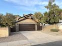 Modern house exterior with a brown garage door at 1520 W Jacinto Ave, Mesa, AZ 85202