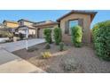 Tan house exterior with landscaping and driveway at 23079 E Stacey Rd, Queen Creek, AZ 85142