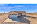 Aerial view of a house with attached garage at 37504 W Elm Ave, Tonopah, AZ 85354