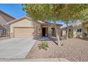 Charming house with a two-car garage and well-maintained landscaping at 6908 W Harwell Rd, Laveen, AZ 85339