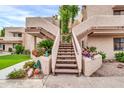 Exterior condo stairs with landscaping at 7061 E Broadway Rd # 58, Mesa, AZ 85208