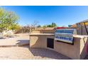 Built-in BBQ grill and prep area for outdoor cooking at 8813 S 13Th Pl, Phoenix, AZ 85042