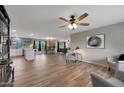 Open living space featuring hardwood floors and ceiling fan at 3502 E Janice Way, Phoenix, AZ 85032