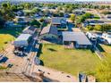Aerial view of property showing the house and several outbuildings at 5701 N 105Th Ln, Glendale, AZ 85307