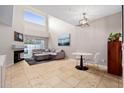 Spacious living room with sectional sofa, fireplace, and high ceilings at 7710 E Gainey Ranch Rd # 157, Scottsdale, AZ 85258