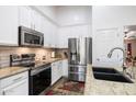 Well-equipped kitchen featuring granite countertops and stainless steel appliances at 1964 W Sawtooth Way, San Tan Valley, AZ 85144