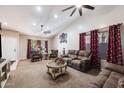Spacious living room with comfortable seating and high ceilings at 1964 W Sawtooth Way, San Tan Valley, AZ 85144