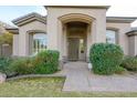 Front entrance of the home with landscaping and walkway at 6501 E Monte Cristo Ave, Scottsdale, AZ 85254