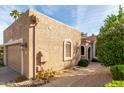 Tan stucco house with a two-car garage and desert landscaping at 25515 N Forest Rd # 1, Rio Verde, AZ 85263