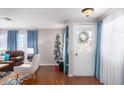 Bright and airy entryway with hardwood floors and a charming door at 3104 E Broadway Rd # 22, Mesa, AZ 85204