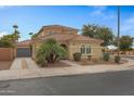 Two-story house with a tile roof, landscaping, and a two-car garage at 841 E Runaway Bay Pl, Chandler, AZ 85249