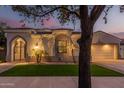 Beautiful two-story home with a well-manicured lawn and attractive facade at 945 W Elm St, Litchfield Park, AZ 85340