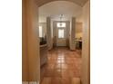 Bright entryway with terracotta tile floors and view to living room at 14028 N Edgeworth N Dr # A, Fountain Hills, AZ 85268