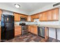 Kitchen boasts wood cabinets, granite counters, and stainless steel appliances at 225 N Standage -- # 10, Mesa, AZ 85201