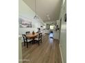 Kitchen and dining area with wood-look floors at 455 S Delaware Dr # 148, Apache Junction, AZ 85120