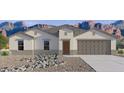 New construction home exterior; two-car garage, desert landscaping at 12401 E Bahia Ct, Florence, AZ 85132