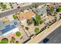 Aerial view of single-level home with backyard and solar panels at 17602 N Desert Glen Dr, Sun City West, AZ 85375