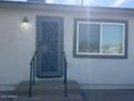 Front view of the house, showing the entrance and a window at 3016 S 125Th Ave, Avondale, AZ 85323