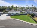 House with large green lawn, located on a cul-de-sac at 705 W Ivy Cir, Mesa, AZ 85201