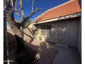Front entry with wrought iron gate and brick walkway at 7434 N 44Th Dr, Glendale, AZ 85301