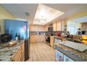 Bright kitchen with granite countertops and stainless steel appliances at 10723 E Navajo Pl, Sun Lakes, AZ 85248