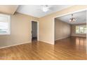 Dining area with wood flooring and access to laundry and living room at 18001 N 99Th Dr, Sun City, AZ 85373