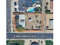 Aerial view showing a single-story home with a pool and large backyard at 5701 N 12Th Pl, Phoenix, AZ 85014