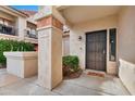 Condo entry with security door and well-maintained landscaping at 9711 E Mountain View Rd # 1516, Scottsdale, AZ 85258