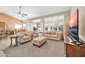 Open living room with view into dining room and kitchen at 14757 W Pinchot Ct, Goodyear, AZ 85395