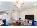 Spacious living room featuring a large TV and comfy seating at 17621 N 18Th Dr, Phoenix, AZ 85023