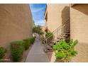 Walkway between condo buildings with landscaping and stairs at 2228 N 52Nd St # 240, Phoenix, AZ 85008