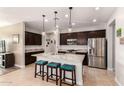 Modern kitchen with granite countertops and stainless steel appliances at 2471 E Hazeltine Way, Gilbert, AZ 85298