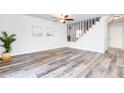 Bright living room with hardwood floors and a view of the staircase at 2556 W Ironstone Ave, Apache Junction, AZ 85120