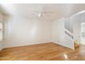 Bright living room with hardwood floors and staircase at 7272 E Gainey Ranch Rd # 91, Scottsdale, AZ 85258