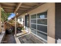 Covered entryway with slate tile flooring and garage access at 1008 W Amelia Ave, Phoenix, AZ 85013