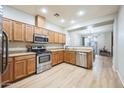 Open kitchen with stainless steel appliances and granite countertops at 1225 N 36Th St # 1032, Phoenix, AZ 85008