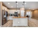 Modern kitchen featuring white cabinets and granite countertops at 17957 W Fairview St, Goodyear, AZ 85338