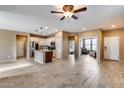 Open concept kitchen with island and stainless steel appliances at 17957 W Fairview St, Goodyear, AZ 85338