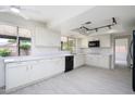 Modern kitchen featuring white cabinets, quartz countertops, and stainless steel appliances at 2717 E Cinnabar Ave, Phoenix, AZ 85028