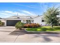 Modern single story home with a landscaped front yard and two-car garage at 4002 N 85Th St, Scottsdale, AZ 85251