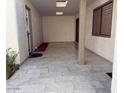 Small laundry area with tile flooring, adjacent to a covered patio at 408 Leisure World --, Mesa, AZ 85206