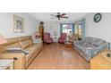 Bright living room featuring hardwood floors and comfy seating at 4736 W Marconi Ave, Glendale, AZ 85306