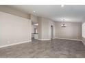 Spacious dining area with tile floors and recessed lighting at 10749 W Tonopah Dr, Sun City, AZ 85373