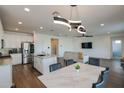 Modern kitchen with island, stainless steel appliances, and granite countertops at 23046 E Estrella Rd, Queen Creek, AZ 85142